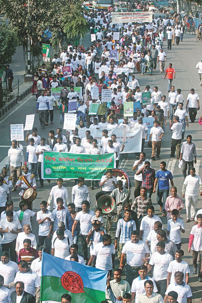 Demanding formulation of the proposed Anti-Discrimination Act to protect the rights of Harijan community, Bangladesh Harijan Oikya Parishad brings out a procession from the capital's Central Shaheed Minar yesterday, marking Global Dignity Day. The photo was taken in front of Jatiya Press Club. Photo: Star