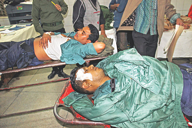 Two of the injured policemen at DMCH. Photo: Palash Khan