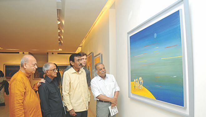 Guests and the artist at the exhibition.