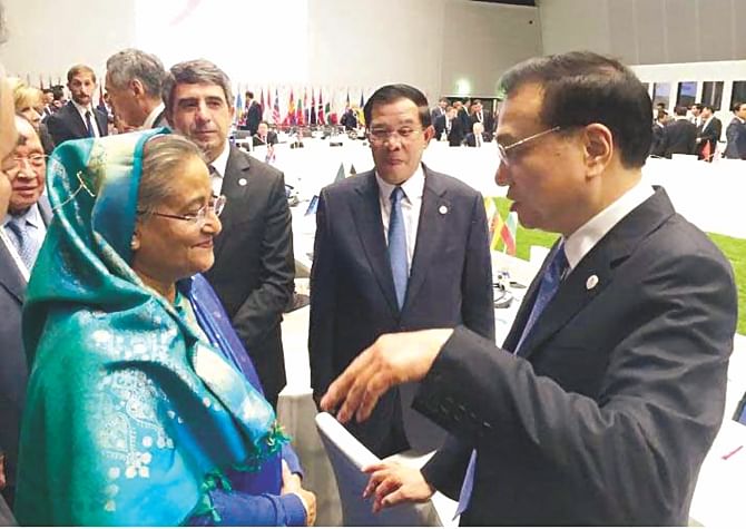 Prime Minister Sheikh Hasina meets her Chinese counterpart Li Keqiang, at Milano Congressi convention centre on the sidelines of 10th ASEM Summit in Italy yesterday. Photo: PID