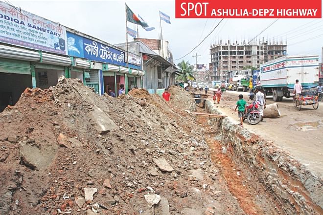 The Roads and Highways Department is finally laying drainage line along a one-kilometre stretch of Ashulia-DEPZ highway and giving temporary fixes to the edges of the road, inset, yesterday ahead of the Eid rush. The pothole-riddled road creates day-long traffic jams. Photo: Palash Khan