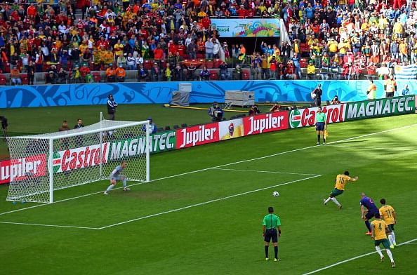 Mile Jedinak of Australia shoots and scores his team's second goal on a penalty kick past Jasper Cillessen of the Netherlands during the 2014 FIFA World Cup Brazil Group B match between Australia and Netherlands at Estadio Beira-Rio on June 18, 2014 in Porto Alegre, Brazil. Photo: Getty Images
