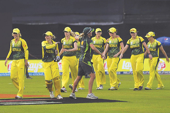 Australian women cricketers celebrate their close 8-run win against the West Indies in the ICC Women's World T20 first semifinal at Mirpur yesterday. Photo: Firoz Ahmed