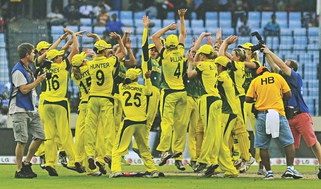 Australia players celebrate their victory over England in the ICC Women's World T20 final at the Sher-e-Bangla National Stadium in Mirpur yesterday. Photo: Star