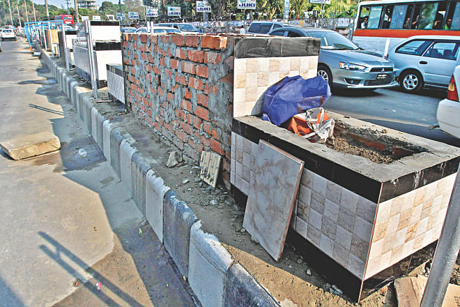 Brick structures wrapped with kitchen and toilet tiles are being built on the central reservation of a thoroughfare near Mohakhali flyover as part of a “beautification project” launched by Dhaka North City Corporation ahead of the ICC T20 World Cup. Experts say that it is tasteless and devoid of aesthetic standards.