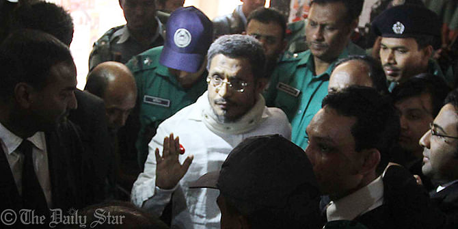 Former home minister Lutfozzaman Babar is being produced before a Chittagong court prior to delivering judgement in 10-truck arms haul cases. The court awards 14 people including Babar death penalty for smuggling in the arms in 2004. Photo: Star