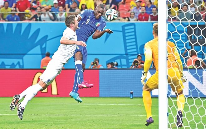 Italy striker Mario Balotelli is not all about muscle and brute power, he has got an intelligent head on his broad shoulders too. Here Super Mario heads in the winning goal against England at the Arena Amazonia on Saturday. Photo: AFP