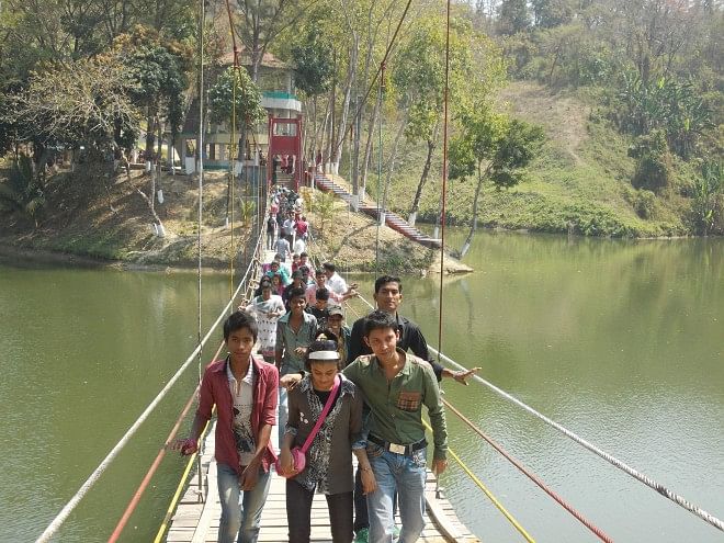 Meghla area of Bandarban sees lively presence of tourists as people seeking a temporary relief from the din and bustle of daily life have started thronging the picturesque hill district. PHOTO: STAR