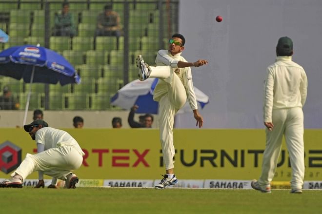 After his team dropped several chances on a day when they were subjected to a leather hunt by Sri Lanka's batsmen, Bangladesh all-rounder Nasir Hossain kicks the ball away in frustration after finally catching Kumar Sangakkara on the second day of the first Test at the Sher-e-Bangla National Stadium in Mirpur yesterday. PHOTO: FIROZ AHMED