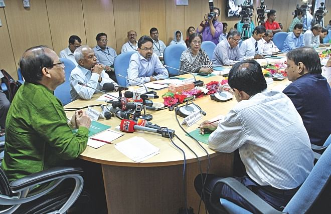 Bangladesh Bank Governor Atiur Rahman attends a press conference at his office in Dhaka yesterday to announce the central bank's half-yearly monetary policy. Photo: STAR