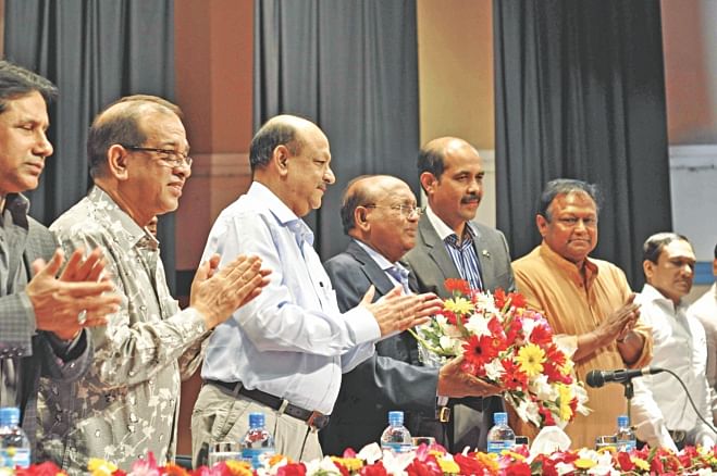 Fourth from left, Tofail Ahmed, commerce minister, attends a meeting at the Bangladesh Garment Manufacturers and Exporters Association office in Dhaka yesterday. Atiqul Islam, BGMEA president, was also present.  Photo: Star
