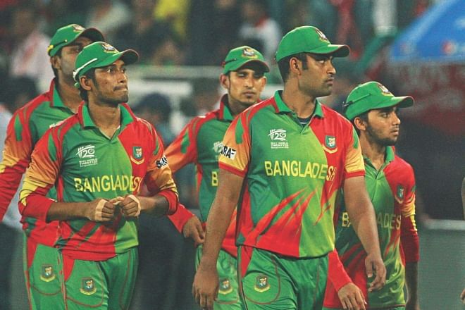 Bangladesh players walk off the field dejected after losing their last ICC World T20 match against Australia at the Sher-e-Bangla National Stadium in Mirpur yesterday. PHOTO: FIROZ AHMED