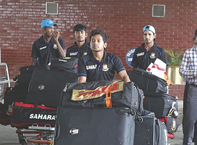 LOOKING INTO A BLEAK FUTURE? A visibly demoralised Bangladesh contingent, which returned home yesterday morning after their dreadful tour of the West Indies, are on their way out of the Hazrat Shahjalal International Airport led by captain Mushfiqur Rahim. Photo: Star 