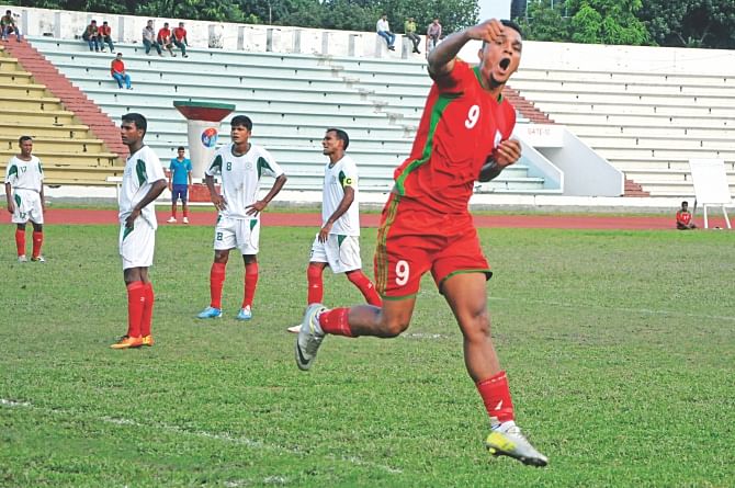 Bangladesh U-23 national team's striker Wahed Ahmed celebrates after scoring the opening goal against Bangladesh Army at the Army Stadium in Banani yesterday. PHOTO: STAR