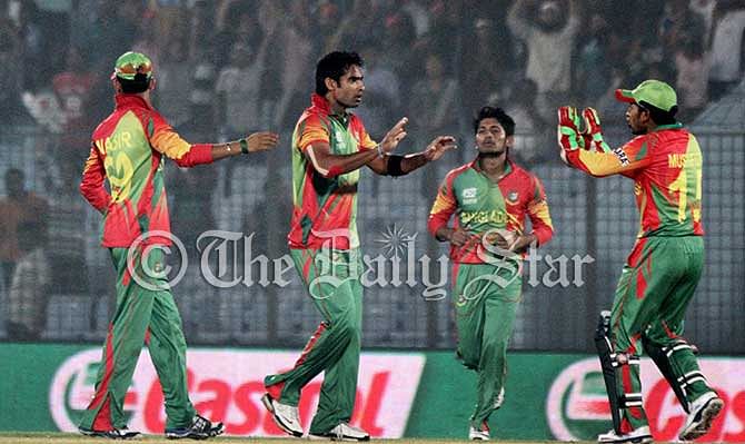 Tigers celebrate a wicket during World T20 tournament against Nepal today at Chittagong. Photo: STAR