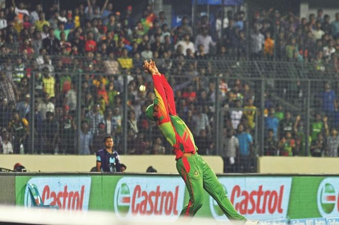 Mahmudullah spills another one. Poor ground fielding and dropped catches were aplenty by the Bangladeshi fielders in their opening Super 10s game against the West Indies at the Sher-e-Bangla National Stadium in Mirpur yesterday.   Photo: Firoz Ahmed 