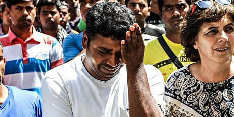 Migrant workers react with shock and tears to the decision to release two of the men on trial; the strawberry pickers had demanded six months' back pay and four were badly injured. Photo: The Guardian 