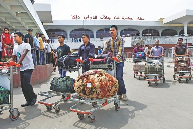 Bangladeshi workers arrive at Shahjalal International Airport yesterday. They were paid less than a quarter of their promised salary in Sudan.  Photo: Rashed Shumon