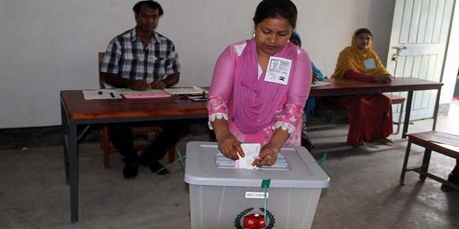 A woman casts her vote at Chandpasha Government Primary School polling centre in Babuganj upazila of Barisal Saturday morning. The voting at 81 upazila parishads in the country begin at 8:00am. Photo: STAR   