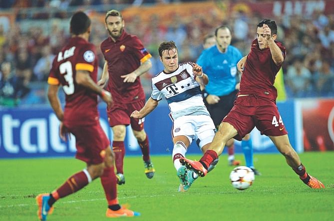 Bayern Munich midfielder Mario Goetze (C) scores the third goal against Roma during their Champions League encounter at the Olympic Stadium in Rome on Tuesday. Photo: AFP