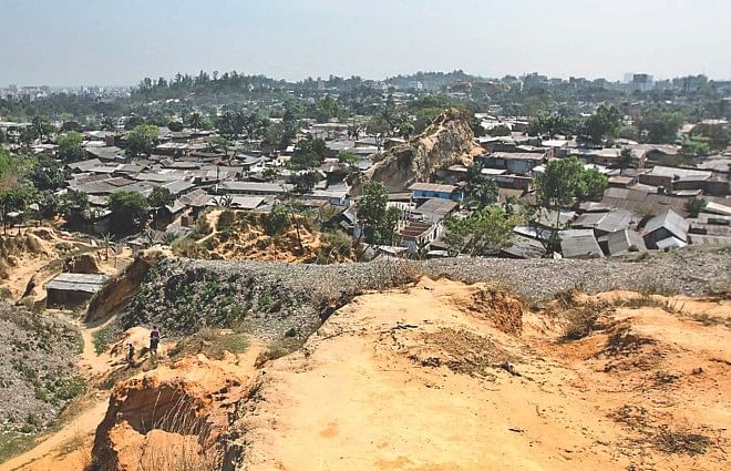 The vast Shantinagar slum has grown on a land where small hills stood tall three decades ago. What now remains of the hilly terrain are only some piles of earth here and there seen among the shanties. Locally influential people have been razing the hills using the political clout of the ruling parties over the years, while the authorities have been shifting responsibilities for the hill conservation onto each other. The photo was taken recently. Photo: Anurup Kanti Das