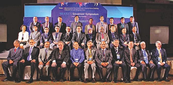 Bangladesh Bank Governor Atiur Rahman poses with other central bankers of different countries at the 29th SEANZA Governors' Symposium held at Radisson Hotel in Dhaka yesterday. Photo: BB