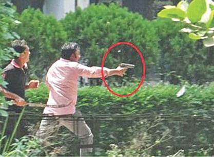 Sajib firing a pistol during violence on the IU campus on September 7 last year. Photo: Courtesy