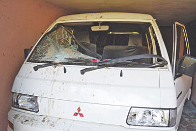 An official microbus vandalised by the attackers. Photo: Star