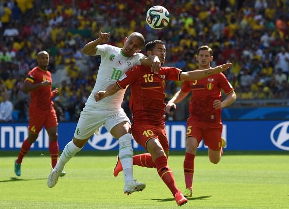 Algeria's forward Sofiane Feghouli (C-L) and Belgium's forward Eden Hazard (C-R) vie for the ball during a Group H football match between Belgium and Algeria at the Mineirao Stadium in Belo Horizonte during the 2014 FIFA World Cup on June 17, 2014. Photo: AFP/Getty Images
