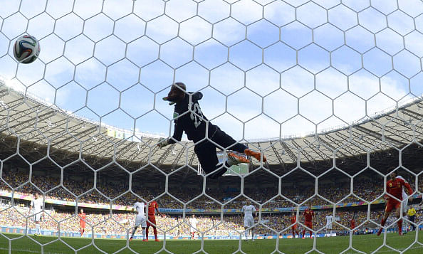 Algeria's goalkeeper Rais Mbohli (C) fails to save a ball shot by Belgium's midfielder Marouane Fellaini (R) during a Group H football match between Belgium and Algeria at the Mineirao Stadium in Belo Horizonte during the 2014 FIFA World Cup on June 17, 2014. Photo: AFP/Getty Images