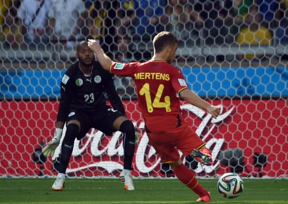 Belgium's forward Dries Mertens (R) shoots to score against Algeria's goalkeeper Rais Mbohli during a Group H football match between Belgium and Algeria at the Mineirao Stadium in Belo Horizonte during the 2014 FIFA World Cup on June 17, 2014. Photo: AFP/Getty Images