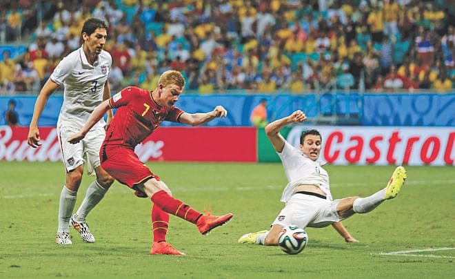 Belgium midfielder Kevin De Bruyne finally breaks the stubborn USA defence with his low right-footer in an entertaining Round of 16 match that exploded in the last ten minutes of a 120-minute thriller at Fonte Nova Arena in Salvador yesterday. Belgium won 2-1. Photo: AFP