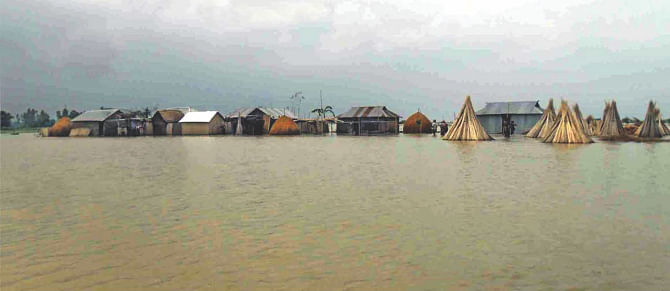 Homes go under water at Belka of Sundarganj upazila in Gaibandha as floods grip the north. The photo was taken yesterday. Photo: Star