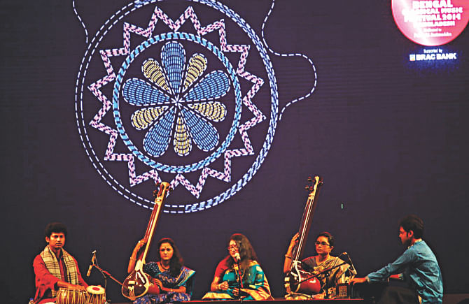 Artistes perform during the second day of the Bengal Classical Music Festival 2014 at the Army Stadium in the capital yesterday evening. Photo: Star