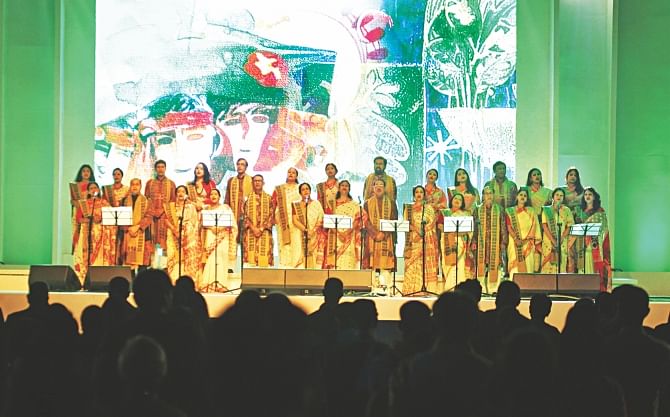Artistes sing the national anthem at the inaugural ceremony of Bengal Classical Music Festival at the Army Stadium in Dhaka yesterday. Photo: Star
