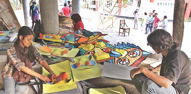 Students of Institute of Fine Arts, CU, busy in preparation of Mongol Shobhajatra. Photo: Anurup Kanti Das