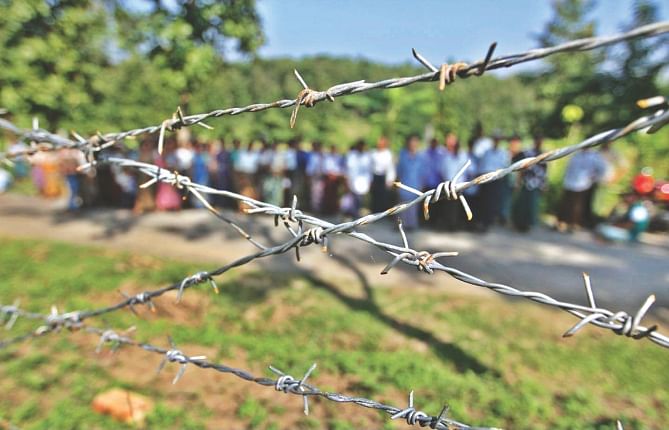 This barbed-wire fence has been put up around 34 acres of land to build the BGB headquarters in Bandarban. People of two Marma villages are dependant on the land. Photo: Anurup Kanti Das