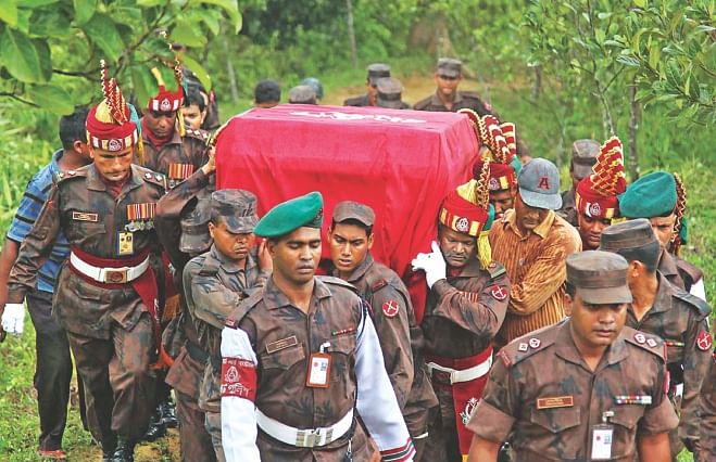 BGB Nayek Mizanur Rahman's body being carried to the helicopter after his first namaz-e-janaza at the 31 Battalion camp of Border Guard Bangladesh yesterday. His body was taken to his Comilla home and buried.  Photo: Anurup Kanti Das