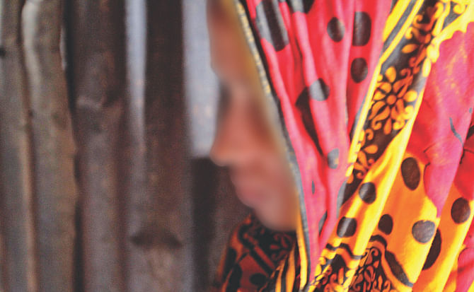 This mother lost her baby born a month after she endured brutal physical and sexual torture in the city's Bhashantek slum. Her face has been blurred in the photo. Photo: Anisur Rahman