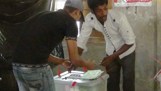 This March 15 photo shows supporters of ruling Awami League-backed chairman candidate Mosharraf Hossain are casting fake votes in broad daylight at West Bapta Government Primary School centre in Bhola during the third phase upazila parishad elections.  