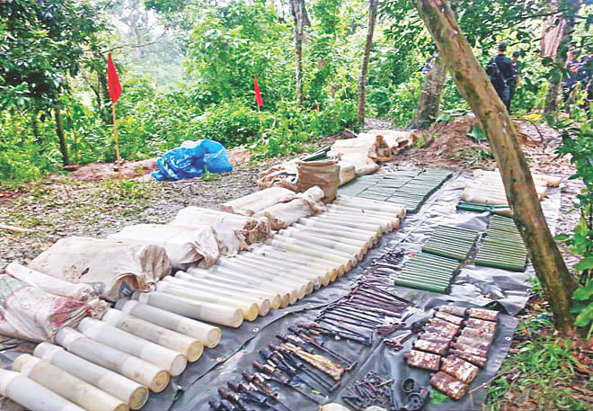 Mortar shells and rocket launcher chargers are lined up after Rab recovered them from an underground bunker, capped with a concrete slab deep inside Satchhari National Park in Chunarughat, Habiganj, only three kilometres from India's Tripura border. Six more bunkers have been spotted there. Photo: Banglar Chokh