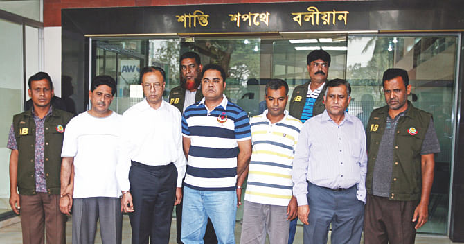 Three Biman officials and two others, arrested for their involvement in a gold smuggling syndicate, are produced before the press at the Dhaka Metropolitan Police media centre yesterday. Photo: Palash Khan 