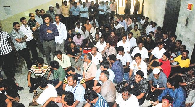 Employees of Biman Bangladesh Airlines lay siege to the office of the acting managing director at Balaka headquarters in the capital yesterday for around three hours over a 14-point charter of demands relating to their jobs and benefits. Photo: Banglar Chokh