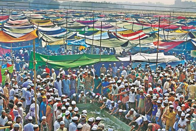 Devotees gather at a reservoir at the Biswa Ijtema ground for ablutions before Zohr prayers yesterday, the second day of the first part of the Ijtema on the Turag in Tongi. The Akheri Munajat (final prayers) will be held today seeking divine blessings of Almighty Allah. Photo: Rashed Shumon