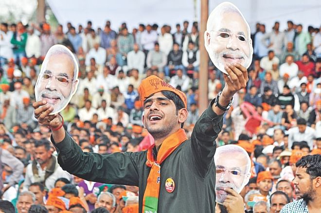 This file picture shows a BJP supporter cheering for Narendra Modi during an election rally in Kashmir in mid April. Photo: AFP