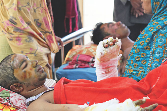 Some of the victims of Friday's arson attack on a bus in Jatrabari recovering there. Photo: Star
