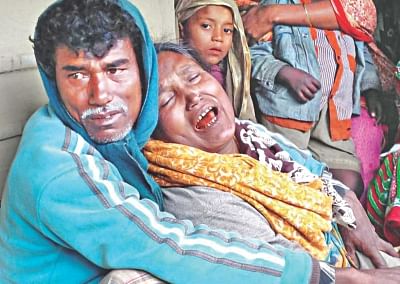 A mother cries her eyes out yesterday for her son who went missing as a boat caught fire and sank in the river Surma in Sunamganj on Monday night.  Photo: Star