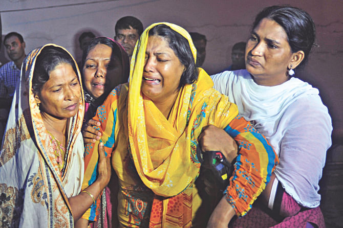 Wife and other family members leave United Hospital on receiving the body of Mohammad Aslam, 58, who died at the hospital two days ago. The hospital agreed to release the body only after the family signed a deal to pay dues of Tk 15 lakh in the next five months.  Photo: Star