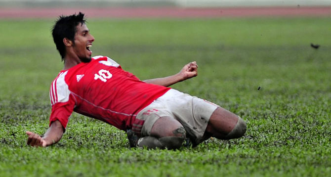 Bangladesh U-23 midfielder Sohel Rana celebrates his winning goal against their visiting Nepalese counterparts in the first of the two-match SS Steel International Friendly Series at the Army Stadium in Banani yesterday. PHOTO: Firoz Ahmed