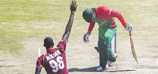 A centurion in the first ODI, Anamul Haque's bowed head after being the first to fall encapsulated Bangladesh's meek surrender of the series as they lost the 2nd ODI against West Indies in Grenada yesterday.  Photo: AFP